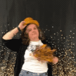 Ms. Crewes tossing a top hat