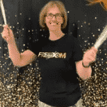 Ms. Dunlap shaking pom poms