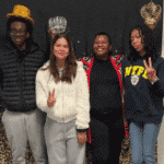 dykes putting crowns on students