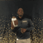 Mr. Jones tossing a football