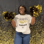 Ms. Lynch waving pom poms