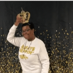 Ms. Riley fixing her crown