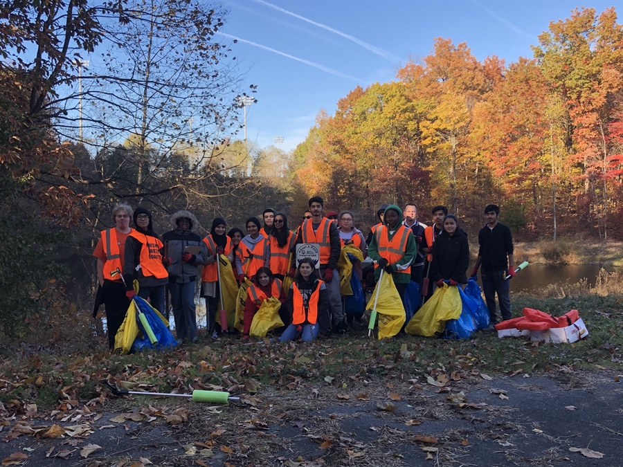 CENS students participate in a clean-up of FDHS pond.