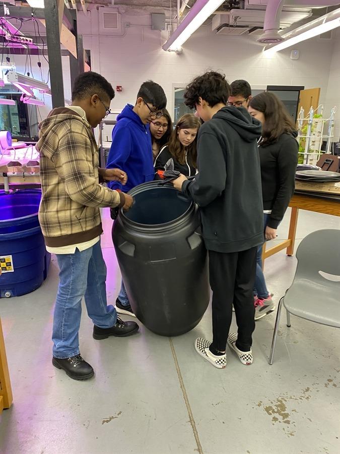 CENS students turn old pickle barrels into rain barrels